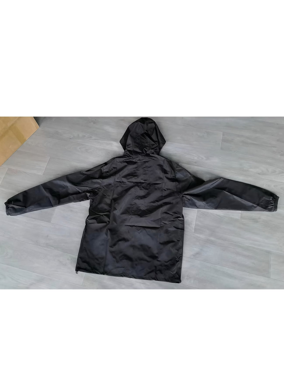 The Graphite Packable Raincoat - back view