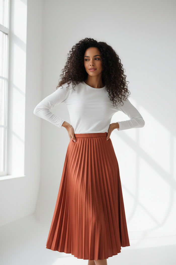 Woman wearing Women's Pleated Midi Skirt in terracotta